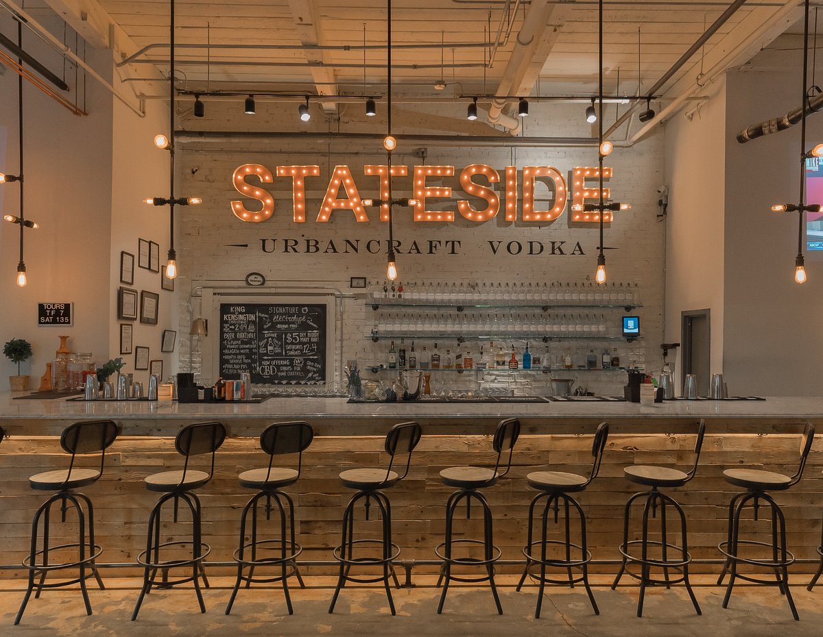 Stateside Vodka Bar interior with the illuminated Stateside Urban Craft Vodka sign above the bar